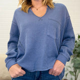 Split Neck Raw Edge Long Sleeve Ribbed Knit Top